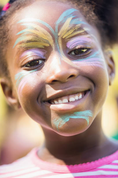 istock Smiling little girl with her head making up 663835148