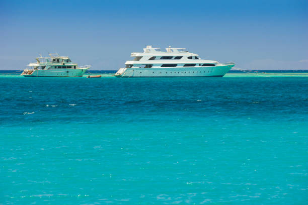 istock yacht on a background of blue sea 663837482