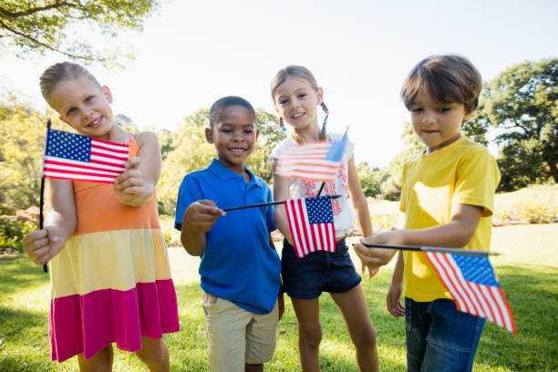 istock Happy children showing usa flag 663838170