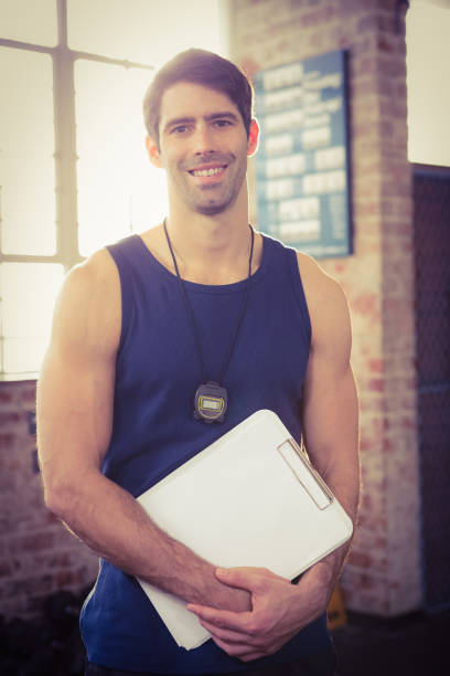 istock Portrait of a trainer holding clipboard 663841524