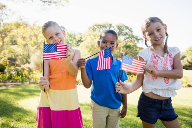 istock Happy children showing usa flag 663845862