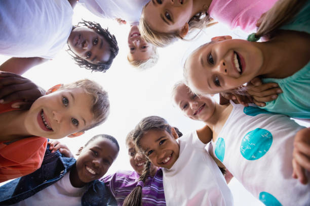 istock Kids posing together during a sunny day at camera 663845988