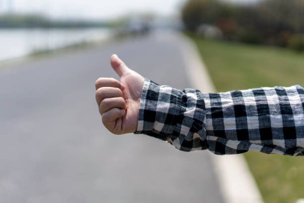 istock hailing taxi gesture at roadside 663848648