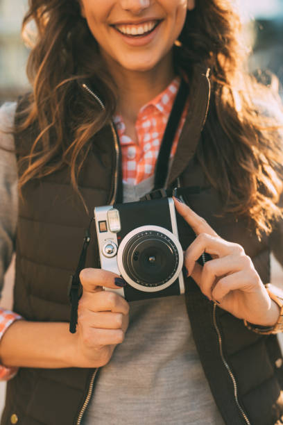 istock Young female photographer 663848686