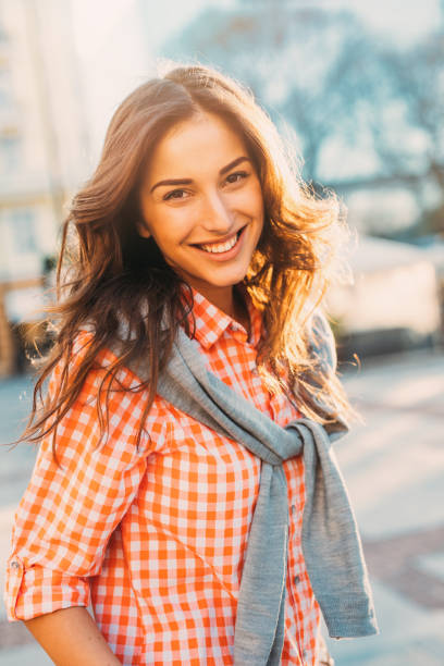 Portrait of a happy young woman outdoors.