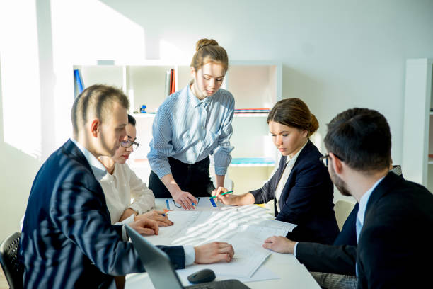 istock Buinesswoman with colleagues 663849322