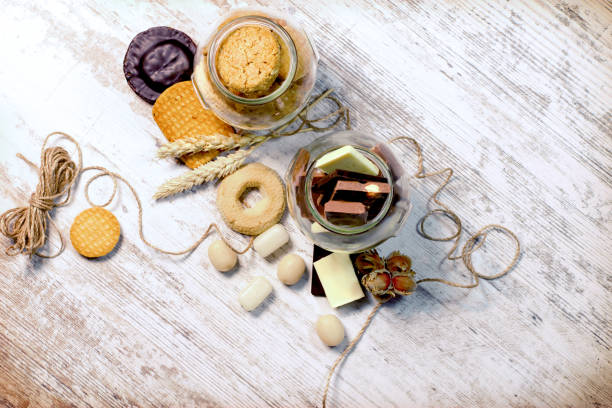 istock Sweets in jar on rustic table, pleasure for your senses 663849740
