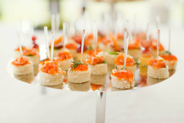 appetizers Delicious appetizers with graved salmon and golden caviar gravad stock pictures, royalty-free photos & images