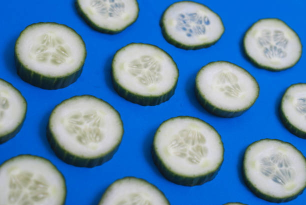 istock The pattern of cucumber on blue background, 663862250