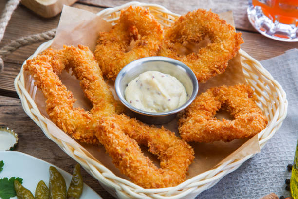 istock Fried calamari rings with sauce 663864024