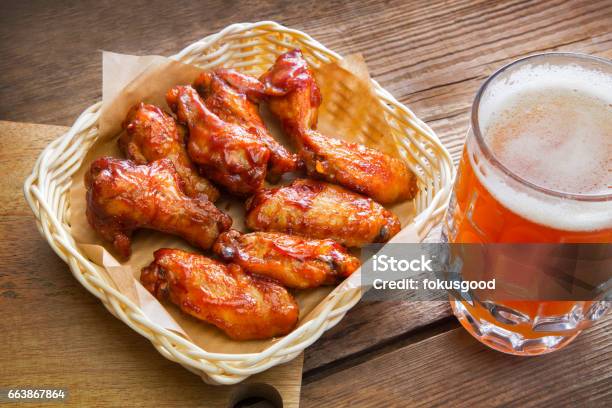 Fried Chicken Wings And A Large Mug Of Beer Stock Photo - Download Image Now - Beer - Alcohol, Chicken Wing, Chicken Meat