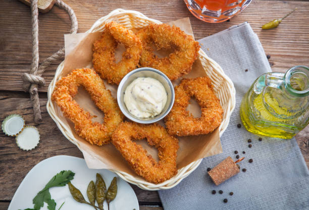 istock Squid rings in batter with sauce 663871200