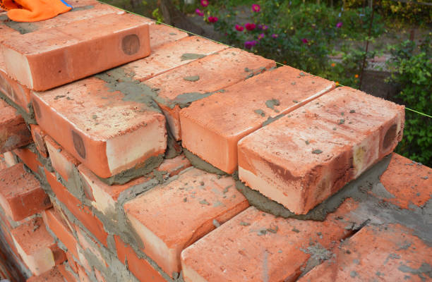 istock Bricklaying, Brickwork. Close up Bricklaying on  House Construction Site. 3 Bricks wall thickness, blocks. 663874012