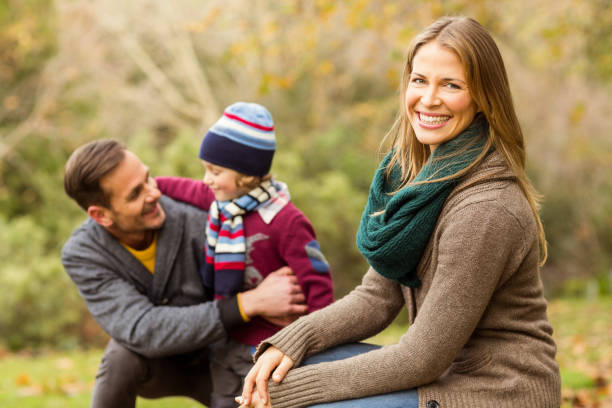 istock Smiling young couple with little boy posing 663891098