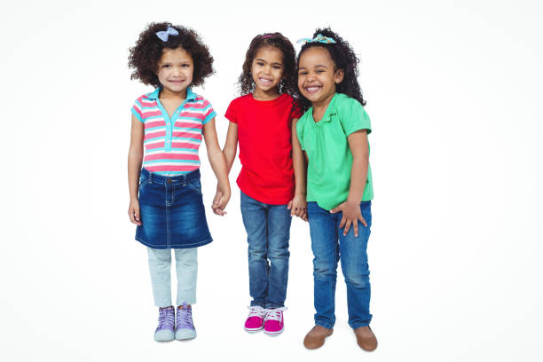 istock Three small girls standing together 663893842
