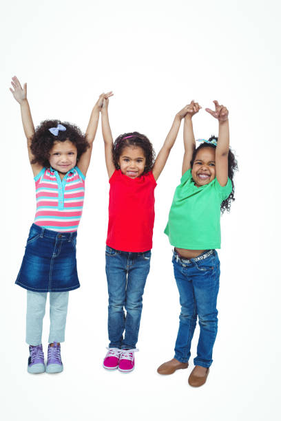 istock Three small girls standing together 663893910