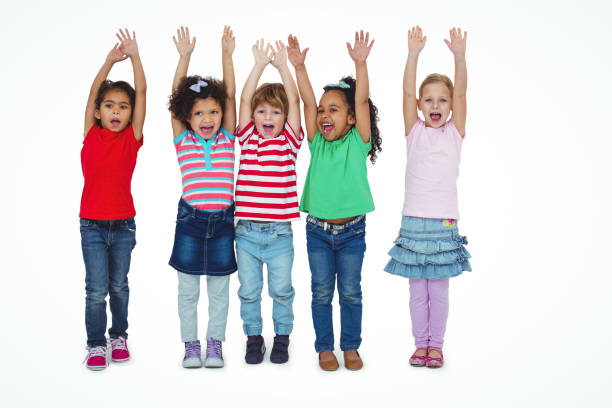 istock Small group of kids standing together with arms raised 663894622
