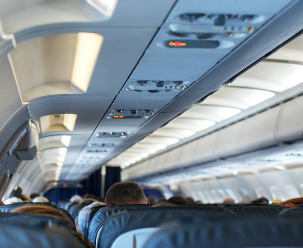 istock Interior inside of the plane with passengers. 663901004