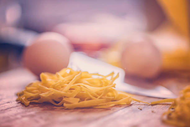 Preparing Homemade Tagliatelle Pasta in Domestic Kitchen