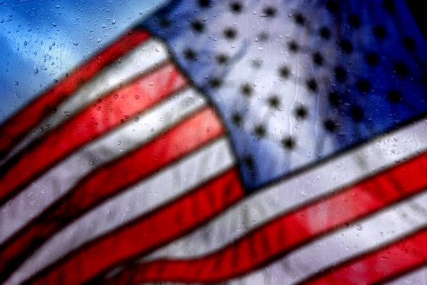 istock rainy day and American flag 663913340