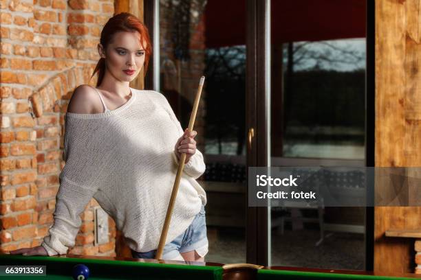 Attractive Woman Plays The Game Of Snooker Pool Table Stock Photo - Download Image Now