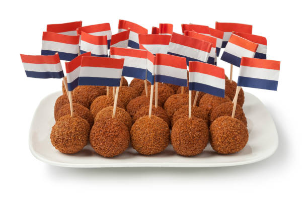 istock Dutch traditional snack croquettes on a dish with a Dutch flag 663920498