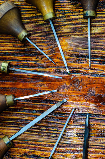 istock Different gravers for jewelry on wooden background 663929016