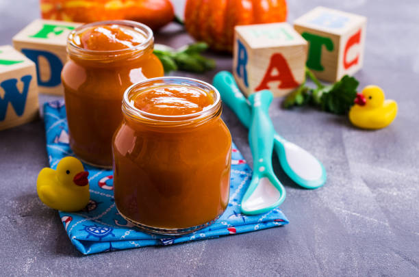 Homemade baby food Homemade baby food from pumpkin and carrots. Selective focus. baby food stock pictures, royalty-free photos & images