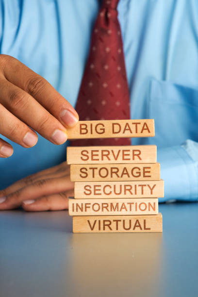 istock Hand arranging wood block concept of big data large size storage systems 663937078