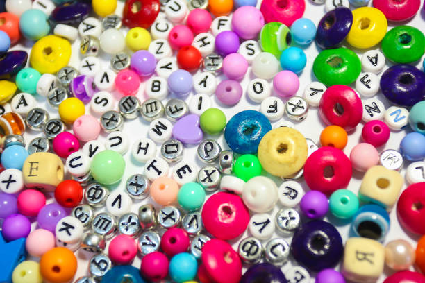 istock Beads Background. Retro Top View Colorful Bead Heap. child background. 663939402