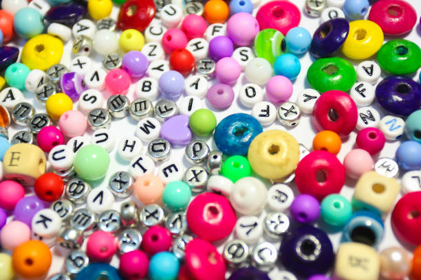 istock Beads Background. Retro Top View Colorful Bead Heap. child background. 663940292