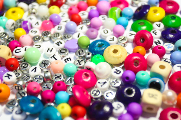 istock Beads Background. Retro Top View Colorful Bead Heap. child background. 663940544