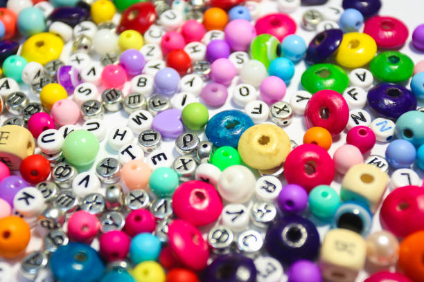 istock Beads Background. Retro Top View Colorful Bead Heap. child background. 663940786