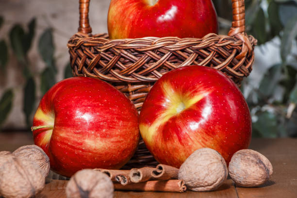 istock Apples are red in the basket on the table. Close-up. 663941442