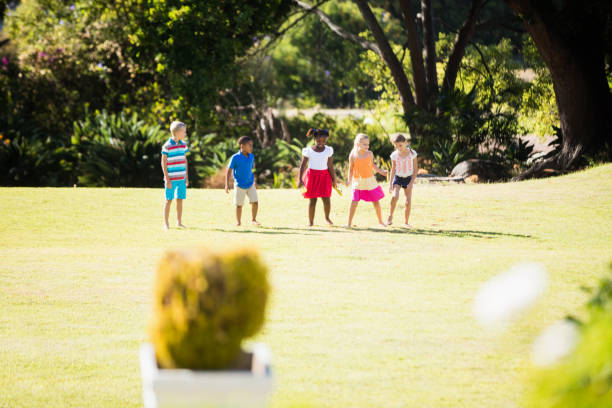 istock Kids playing together during a sunny day 663944244
