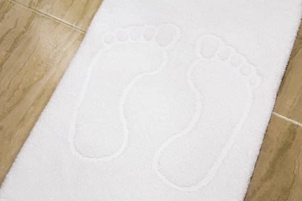 Pair of feet embossed on towel stock photo