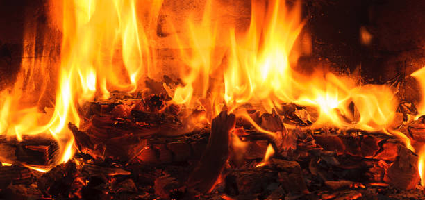 istock Firewood beautifully lit in the fireplace 663948734