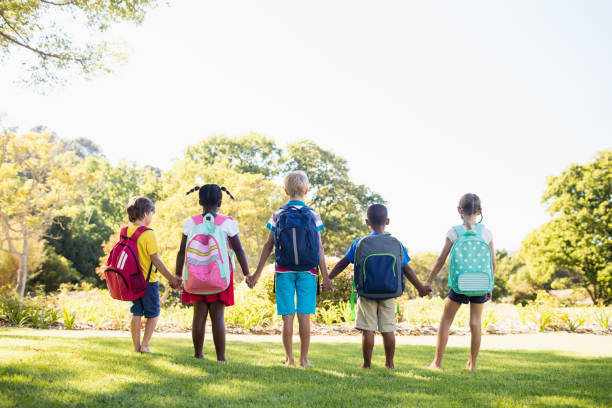 istock Kids posing together during a sunny day at camera 663949286