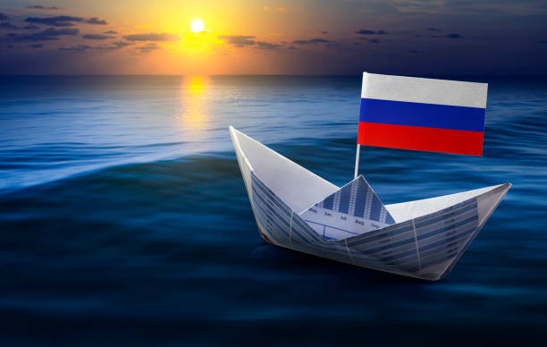 istock Russia flag with boat made from paper graph on sea 663951956