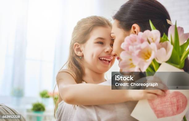 Daughter Congratulates Mom Stock Photo - Download Image Now - Adult, Baby - Human Age, Beautiful People