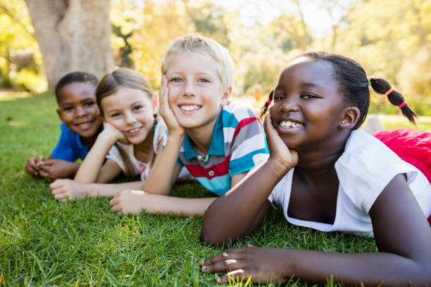 istock Kids posing together during a sunny day at camera 663955036