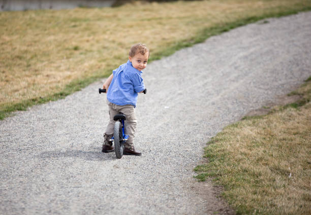 istock Toddler boy riding bike. 663955378