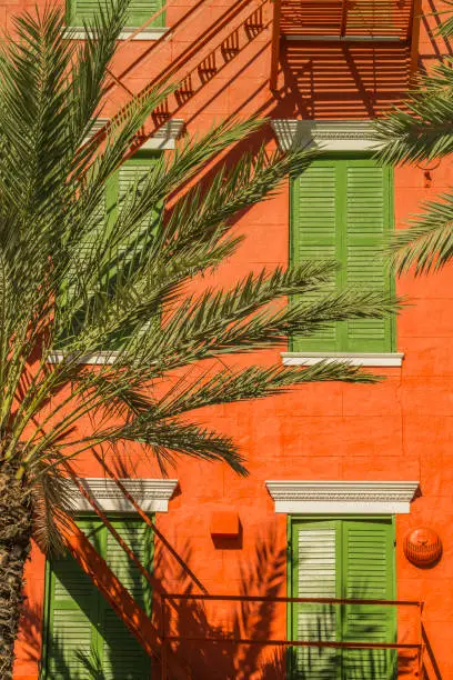 Photo of Green shutters on Orange building in the French Quarter in New Orleans