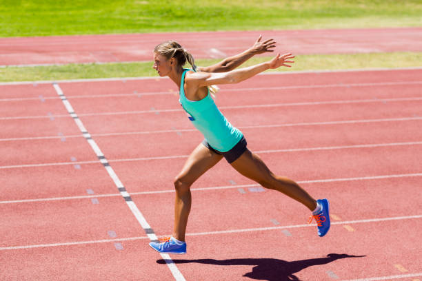 istock Female athlete running on the racing track 663959522