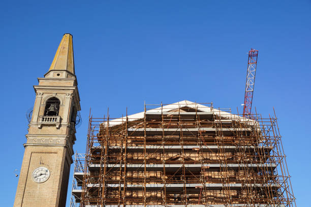 istock Extensive scaffolding providing platforms for work in progress on a church in restructuring 663962996