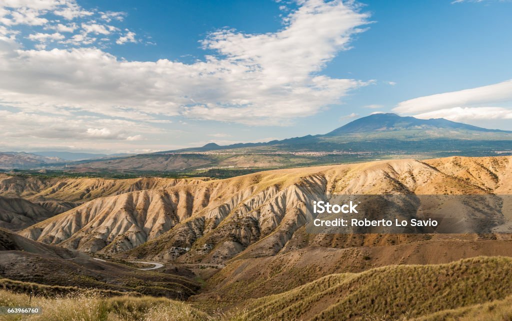 Badlands in the countryside of Sicily, near Biancavilla; volcano Etna in the background Arid Climate Stock Photo