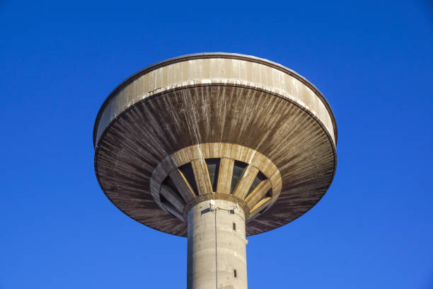 istock concrete two water towers against blue sky 663967192