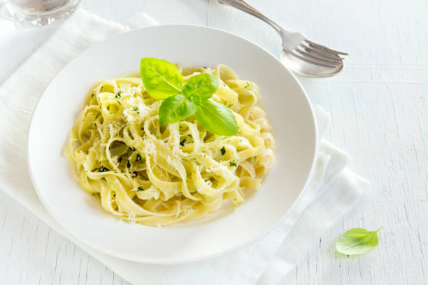 istock Tagliatelle pasta with pesto sauce 663969714