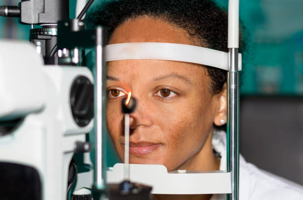istock Young african woman at an optician 663971580