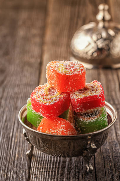 istock Turkish delight on dark wooden background 663974664